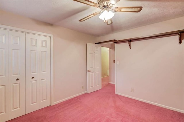 unfurnished bedroom with carpet, ceiling fan, and a closet