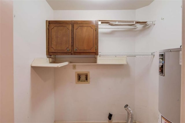 laundry area featuring cabinets, electric dryer hookup, hookup for a washing machine, and gas water heater