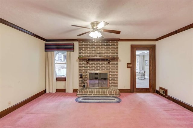 unfurnished living room with a brick fireplace, crown molding, and carpet floors