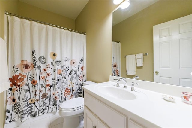 bathroom featuring vanity, a shower with shower curtain, tile patterned floors, and toilet