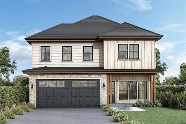 view of front of property featuring a garage and a front yard