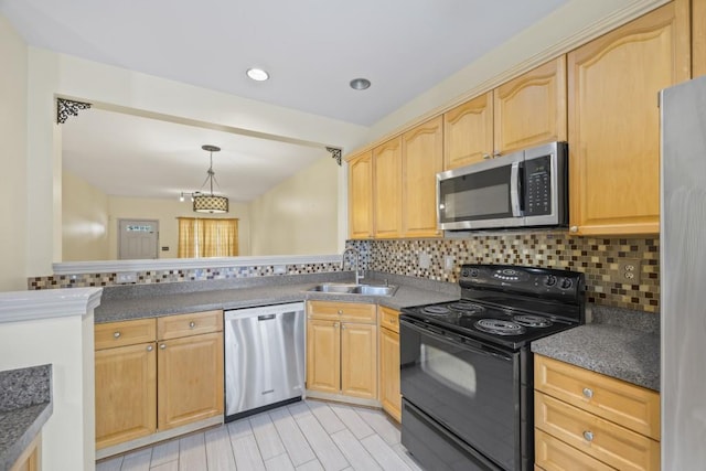 kitchen with decorative backsplash, sink, stainless steel appliances, and light brown cabinets