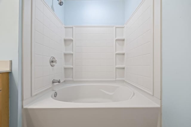 bathroom featuring shower / bathing tub combination and vanity