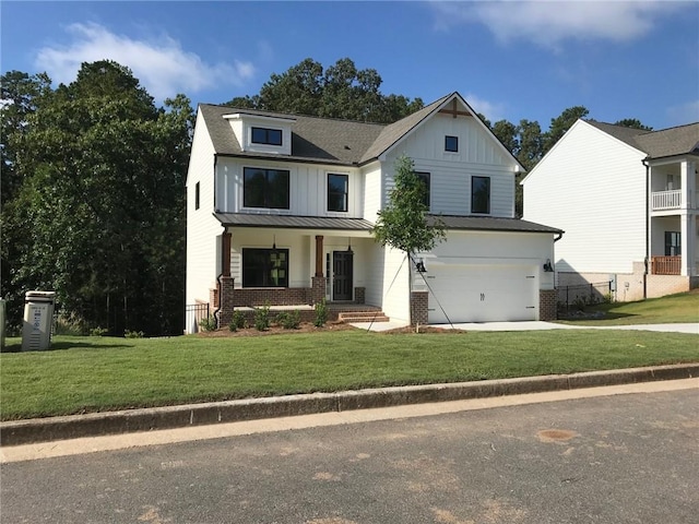 modern farmhouse with a porch, a garage, and a front lawn