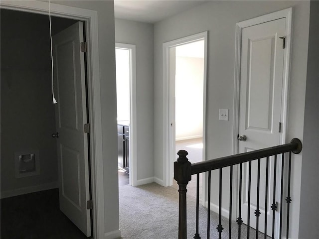 hallway featuring carpet floors