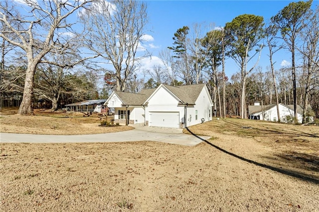 view of side of property with a garage