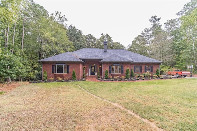 ranch-style home with a front lawn