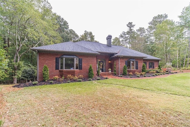 ranch-style house featuring a front yard