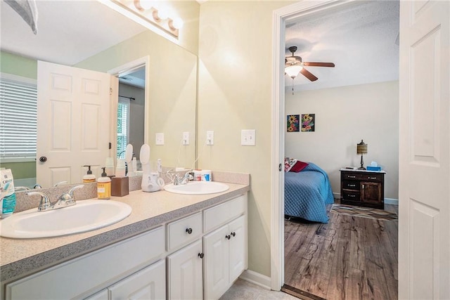 287 Jeremy Dr, Colbert, GA 30628 - full bathroom with ceiling fan, double vanity, ensuite bath, baseboards, and wood finished floors