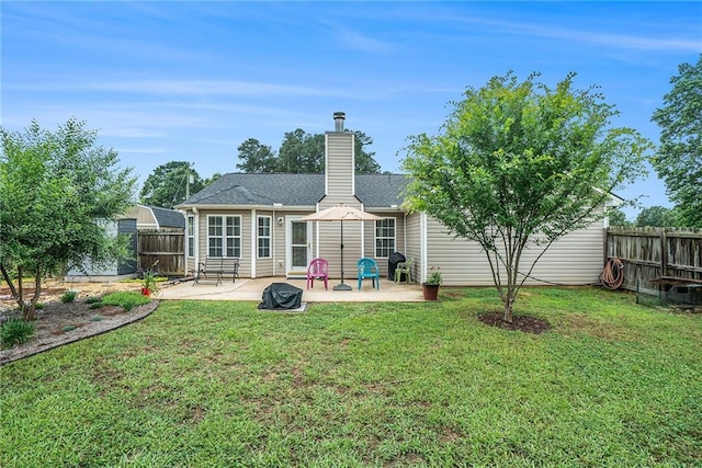 287 Jeremy Dr, Colbert, GA 30628 - back of house featuring a patio and a chimney