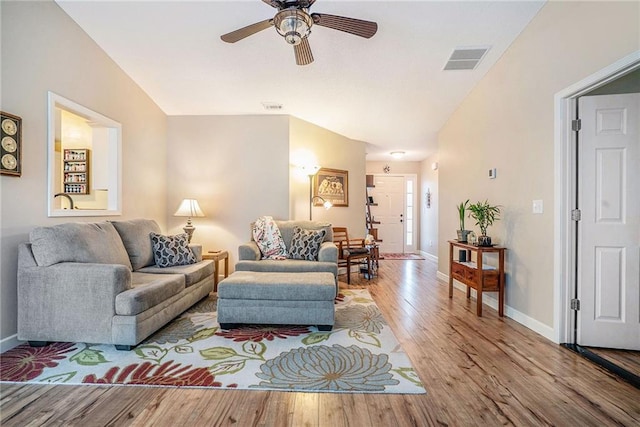 287 Jeremy Dr, Colbert, GA 30628 - living room featuring wood finished floors, ceiling fan, baseboards, and lofted ceiling