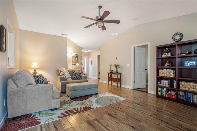 287 Jeremy Dr, Colbert, GA 30628 - living area with ceiling fan, wood finished floors, vaulted ceiling, and baseboards