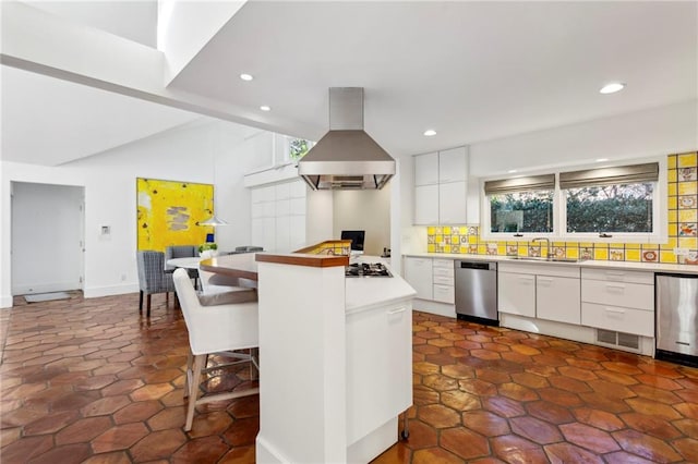 kitchen with dishwasher, a breakfast bar area, decorative backsplash, white cabinets, and island range hood