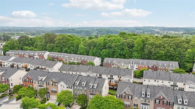 bird's eye view featuring a view of trees and a residential view