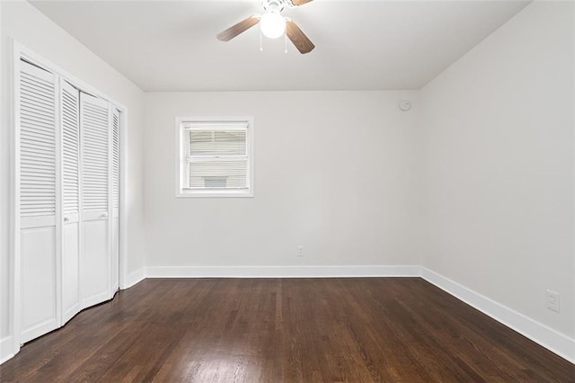 1437 Vesta Ave, East Point, GA 30344 - unfurnished bedroom with dark wood-style floors, a closet, baseboards, and a ceiling fan