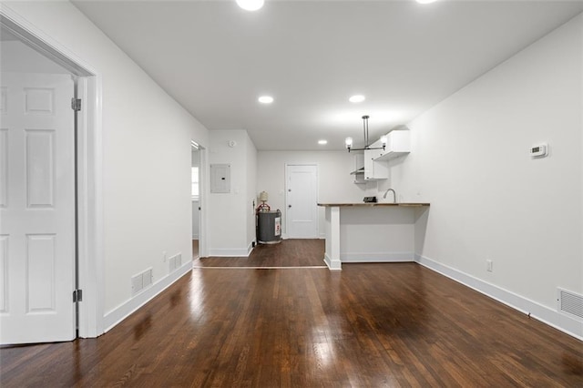 1437 Vesta Ave, East Point, GA 30344 - unfurnished living room with electric panel, baseboards, dark wood-style flooring, recessed lighting, and a sink