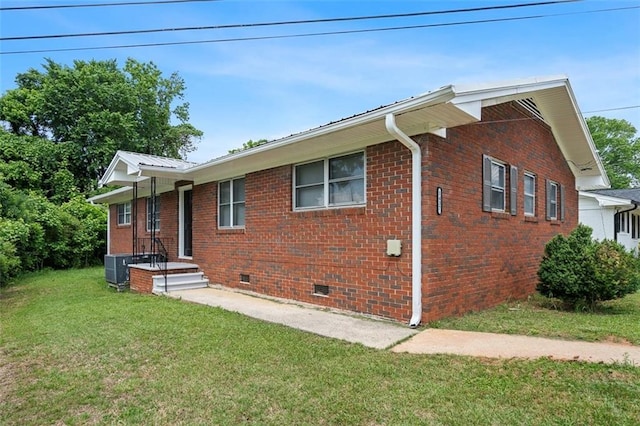 1437 Vesta Ave, East Point, GA 30344 - view of property exterior featuring crawl space, a lawn, brick siding, and metal roof