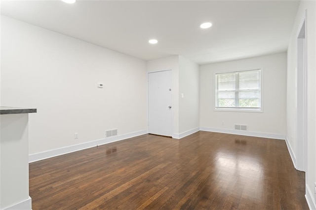 1437 Vesta Ave, East Point, GA 30344 - empty room with dark wood-style flooring, recessed lighting, and baseboards