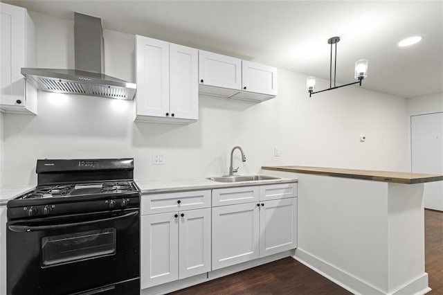 1437 Vesta Ave, East Point, GA 30344 - kitchen with black range with gas cooktop, wall chimney exhaust hood, a sink, and dark wood-style flooring