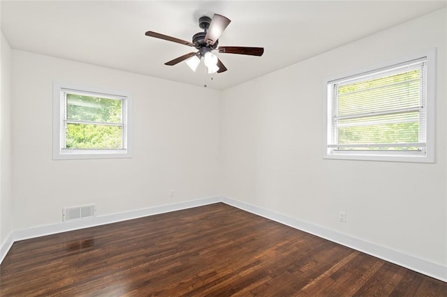 1437 Vesta Ave, East Point, GA 30344 - unfurnished room with baseboards, dark wood-type flooring, and a ceiling fan
