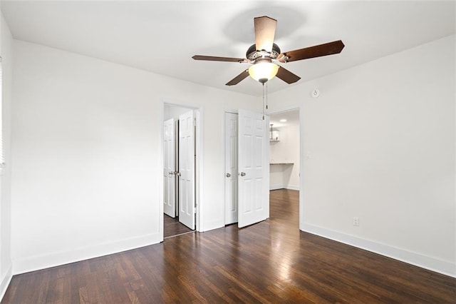 1437 Vesta Ave, East Point, GA 30344 - unfurnished bedroom featuring dark wood-style floors, baseboards, ceiling fan, and a closet