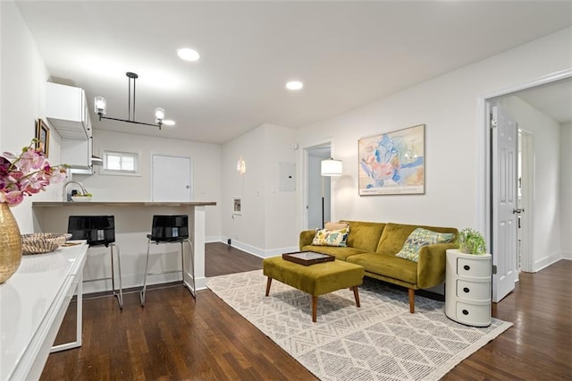 1437 Vesta Ave, East Point, GA 30344 - living area with dark wood finished floors, baseboards, and recessed lighting