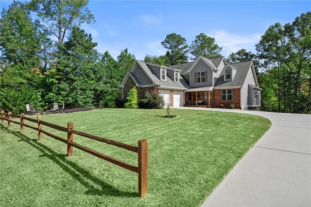 view of front of house with a front yard and a garage