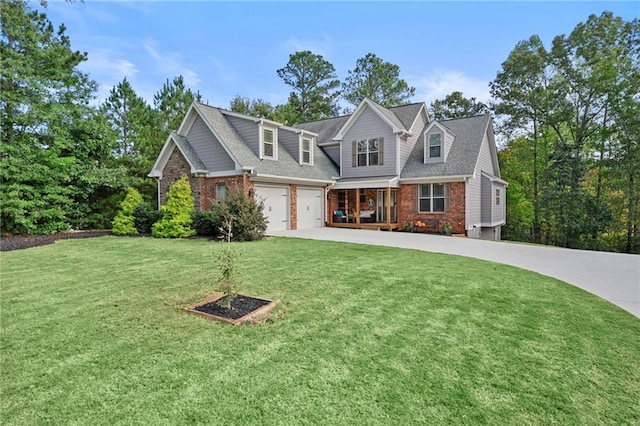 view of front of house featuring a front yard and a garage