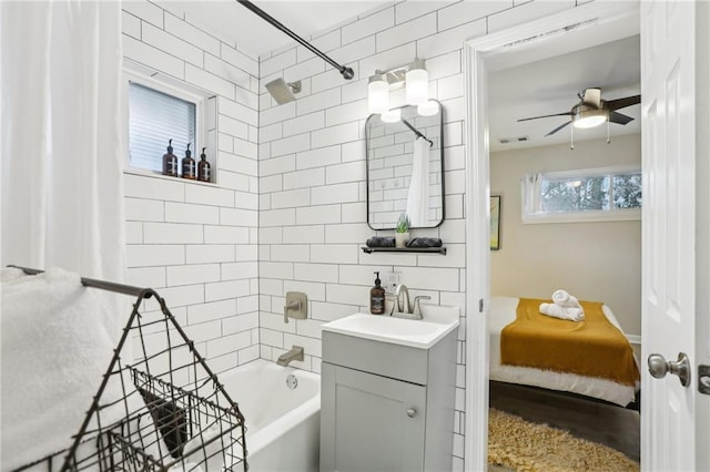 full bath with shower / bathtub combination, visible vents, a ceiling fan, and vanity