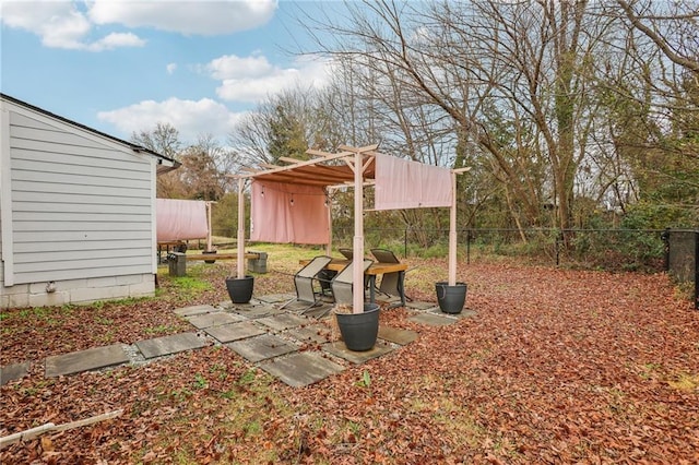 view of yard with an outbuilding and fence