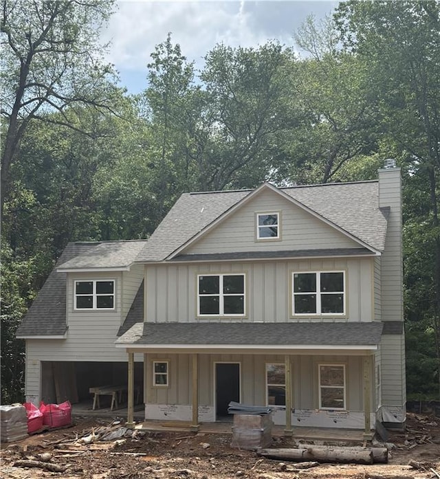 742 Joy St, Jackson, GA 30233 - view of front of home with roof with shingles, a chimney, board and batten siding, and a porch