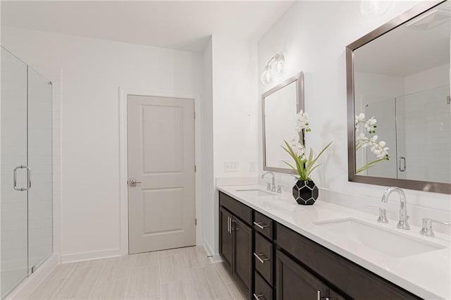 bathroom with walk in shower and vanity