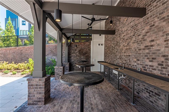 view of patio / terrace featuring sink and ceiling fan