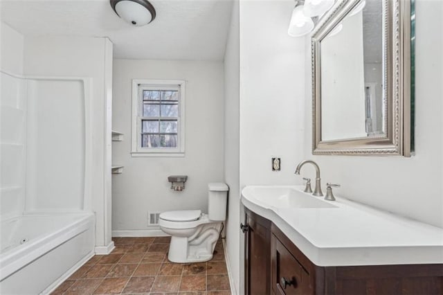 full bathroom with toilet, vanity, tub / shower combination, and baseboards