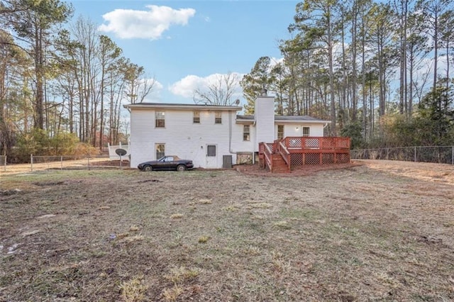 back of house with a chimney, a wooden deck, stairway, and fence private yard