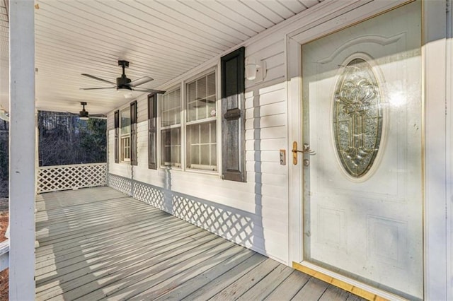 wooden deck with a ceiling fan and covered porch