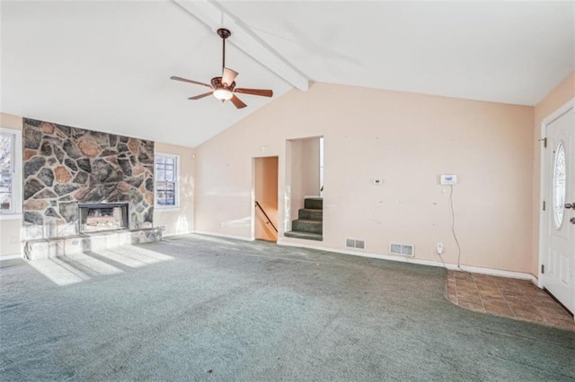 unfurnished living room featuring visible vents, a ceiling fan, carpet flooring, and stairway