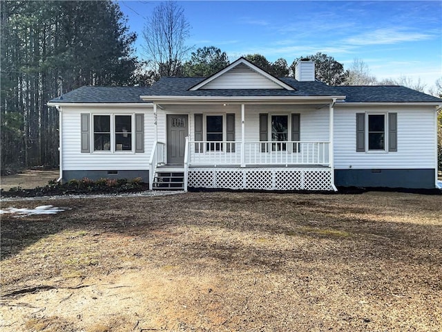 ranch-style house with a front lawn and covered porch