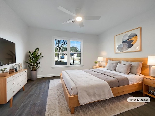 bedroom with ceiling fan and dark wood-type flooring