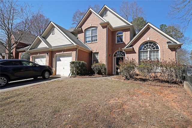 traditional-style home featuring a garage, fence, concrete driveway, and brick siding