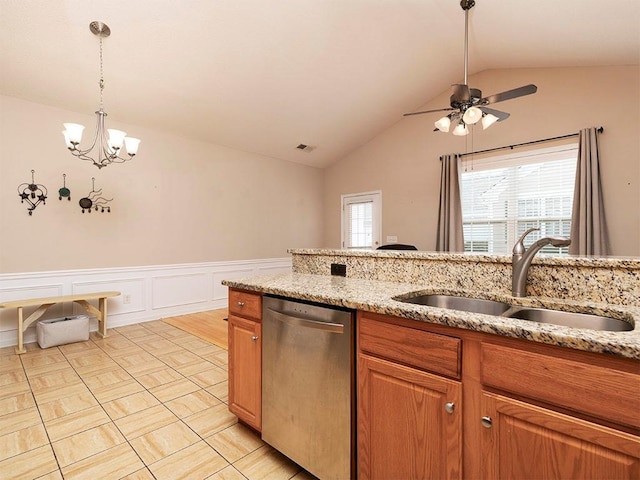 kitchen with dishwasher, ceiling fan with notable chandelier, lofted ceiling, and sink