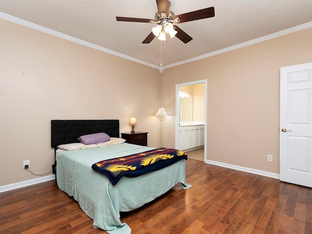 bedroom featuring ceiling fan, dark hardwood / wood-style floors, ornamental molding, and ensuite bathroom