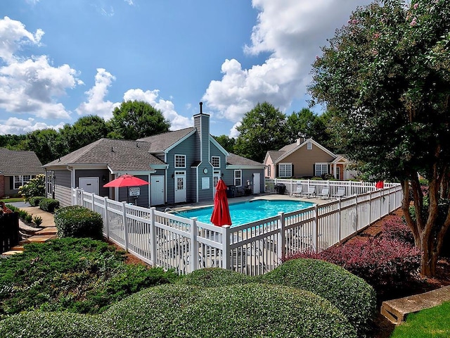 view of swimming pool with a patio area