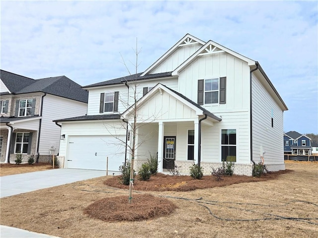 view of front of house featuring a porch and a garage