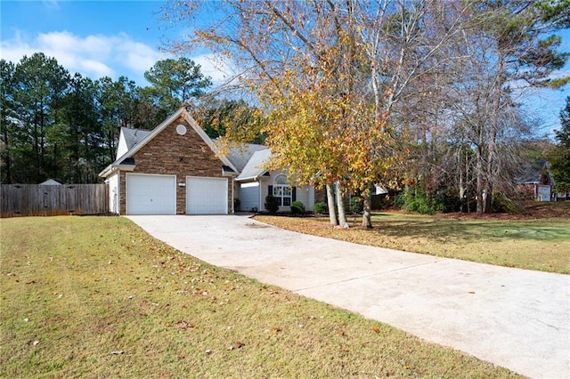 view of front facade featuring a garage and a front lawn