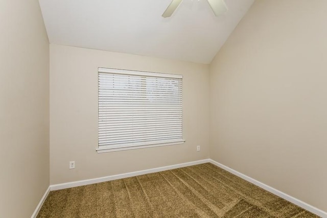 carpeted spare room featuring ceiling fan and lofted ceiling