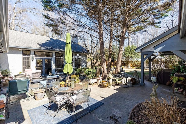 view of patio featuring outdoor dining area