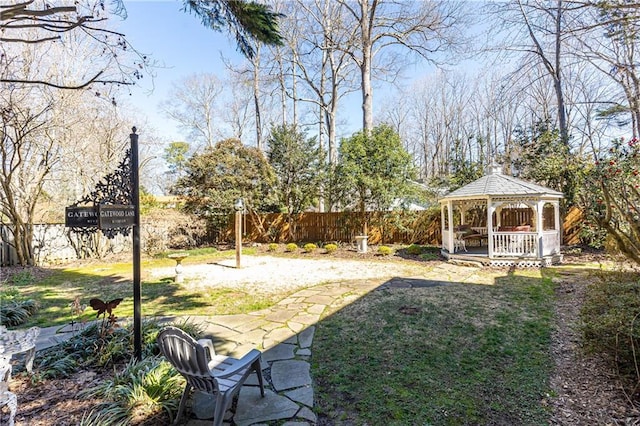 view of yard with a gazebo and fence