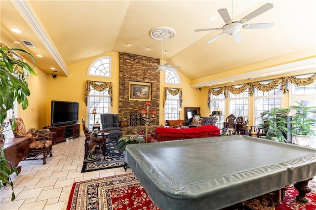 game room featuring billiards, visible vents, a ceiling fan, a stone fireplace, and high vaulted ceiling