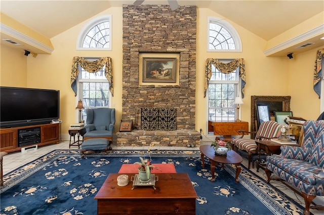 living area with high vaulted ceiling, tile patterned flooring, visible vents, and a fireplace